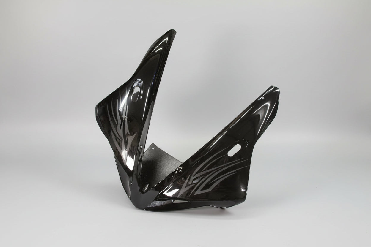 Black motorcycle fairing on a white background