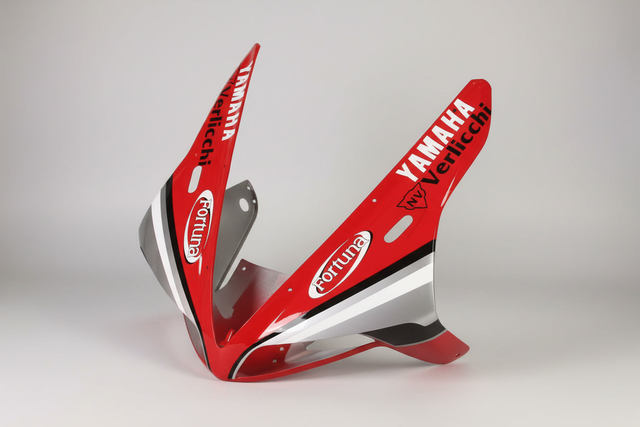 Red motorcycle fairing with Yamaha and Verlicchi branding on a white background