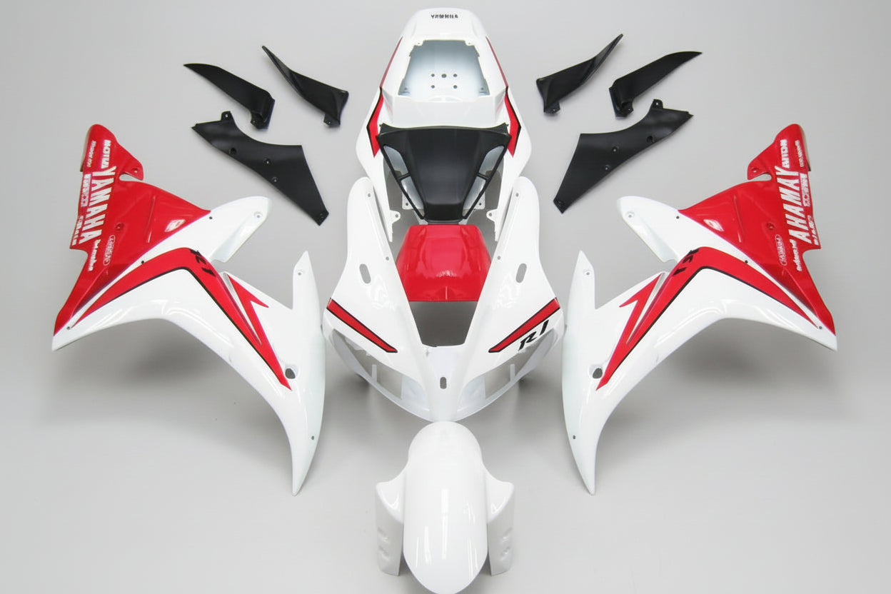 Motorcycle bodywork pieces with red and white design on a white background