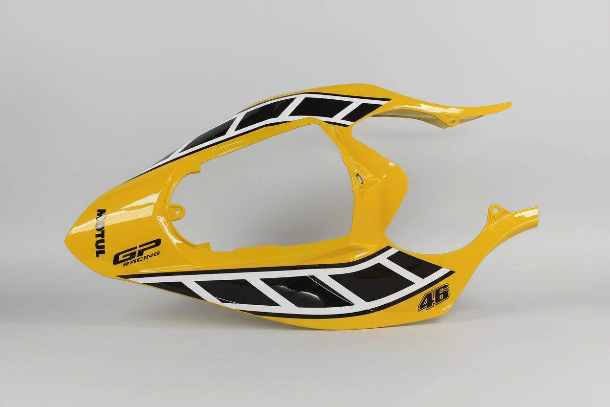 Yellow motorcycle fender with black and white design on a white background