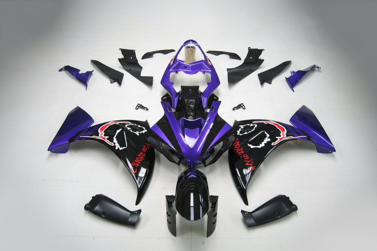 Motorcycle bodywork pieces in purple and black on a gray background