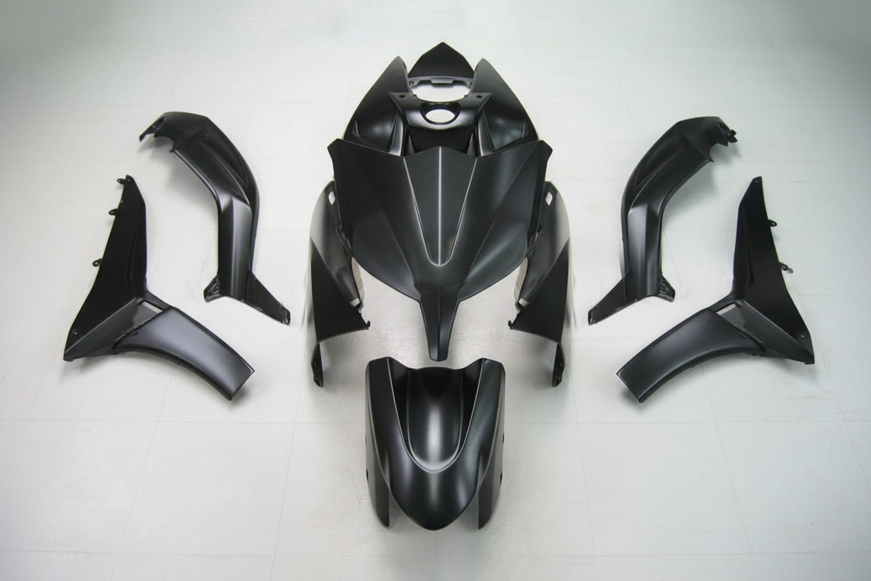 Black motorcycle body parts on a white background