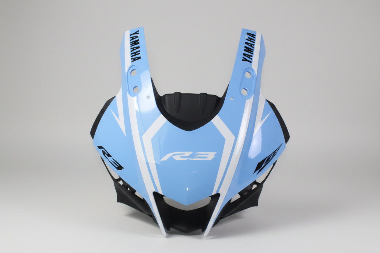 Blue motorcycle fairing with Yamaha branding on a white background