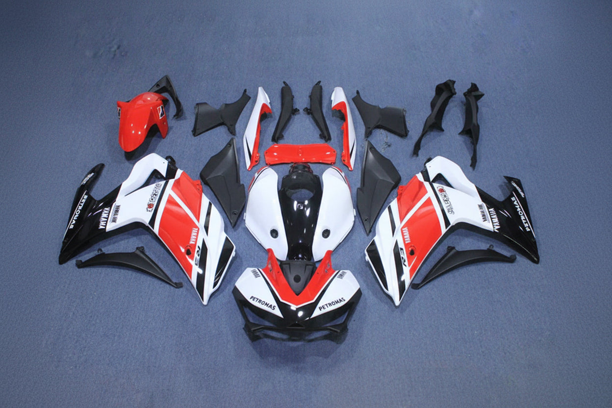 Motorcycle bodywork pieces in red, white, and black on a gray background