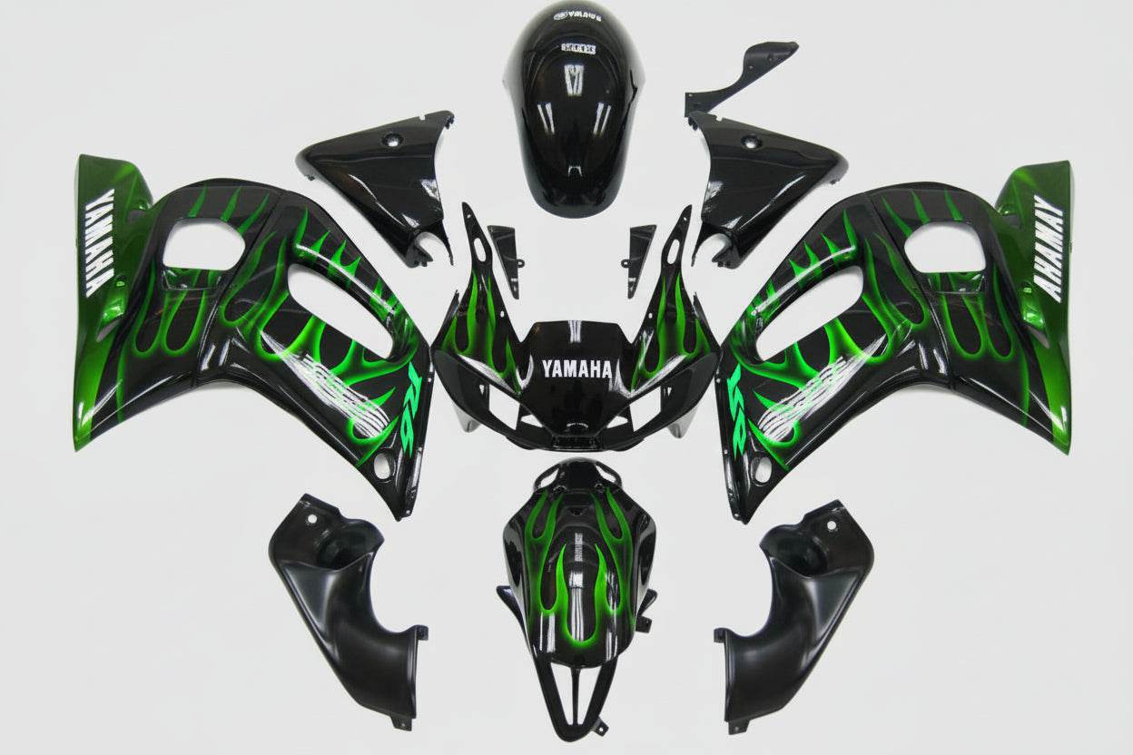 Motorcycle bodywork with green and black design on a white background