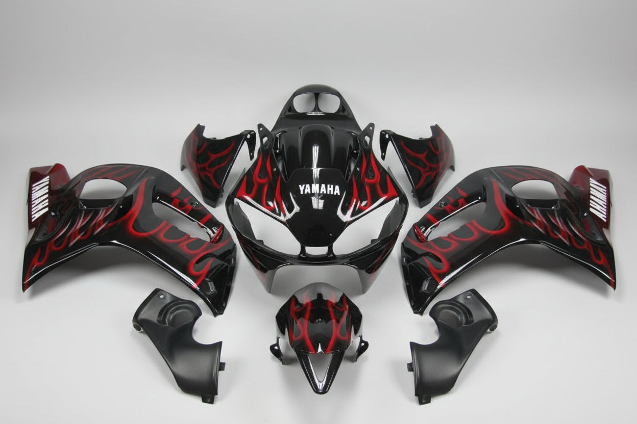 Black and red motorcycle bodywork pieces with Yamaha branding on a white background
