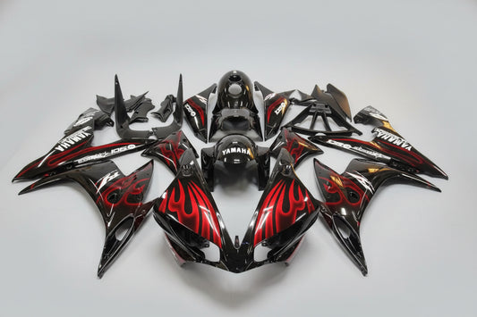 Motorcycle bodywork pieces with red and black design on a white background