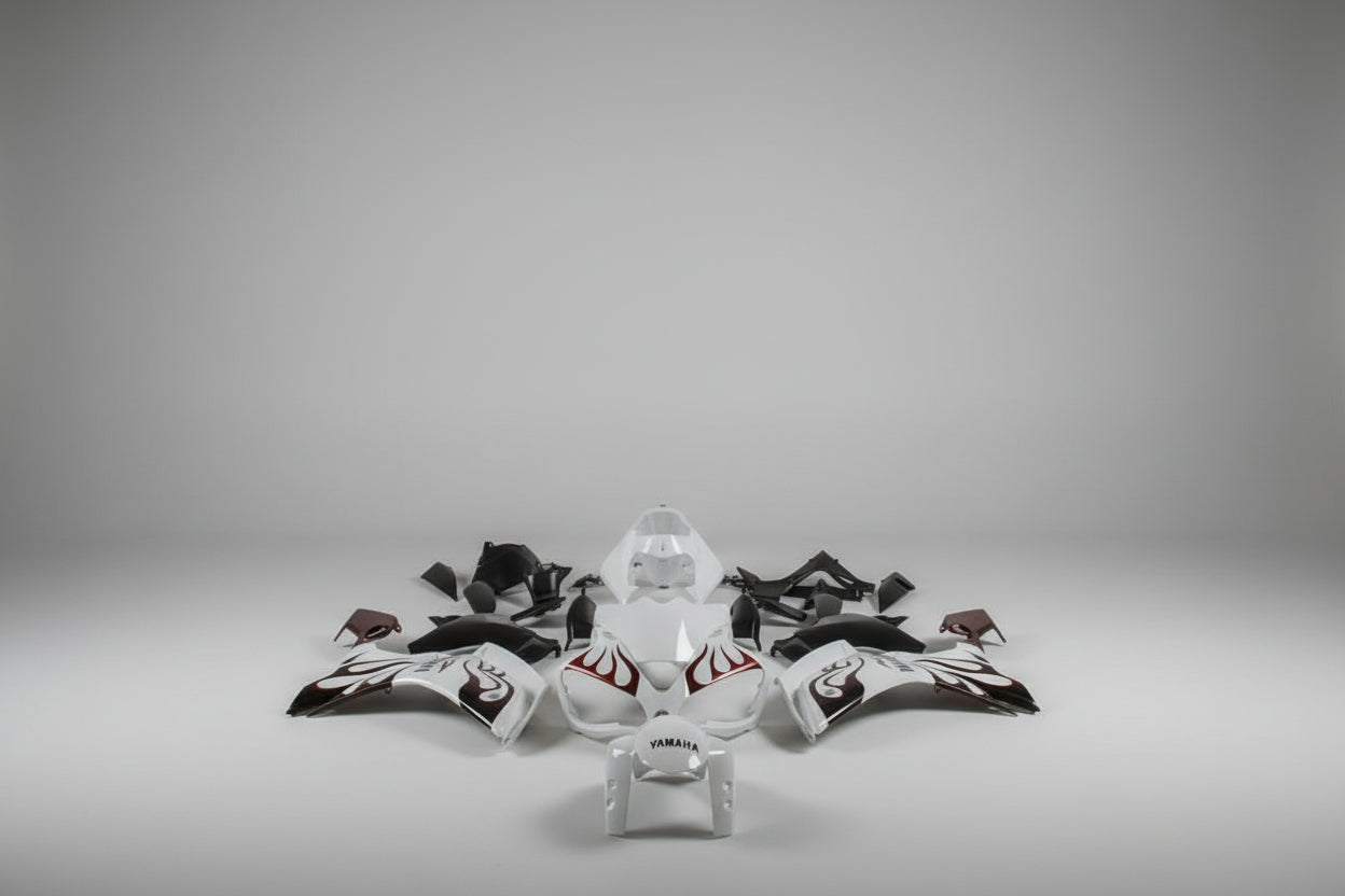 Motorcycle body parts with Yamaha logo on a white background