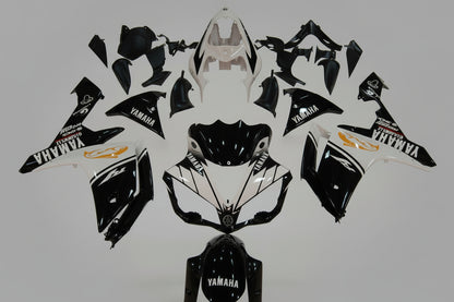 Motorcycle body parts with Yamaha logo on a white background