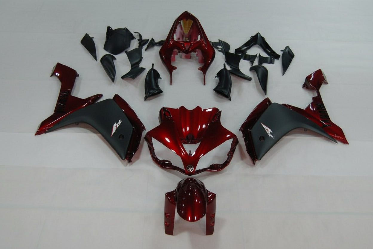 Red and black motorcycle body parts on a white background