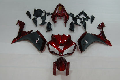 Red and black motorcycle body parts on a white background
