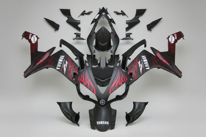 Motorcycle bodywork with red and black design on a white background