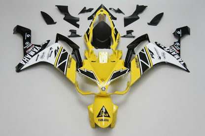 Yellow and black motorcycle body kit with branding on a white background