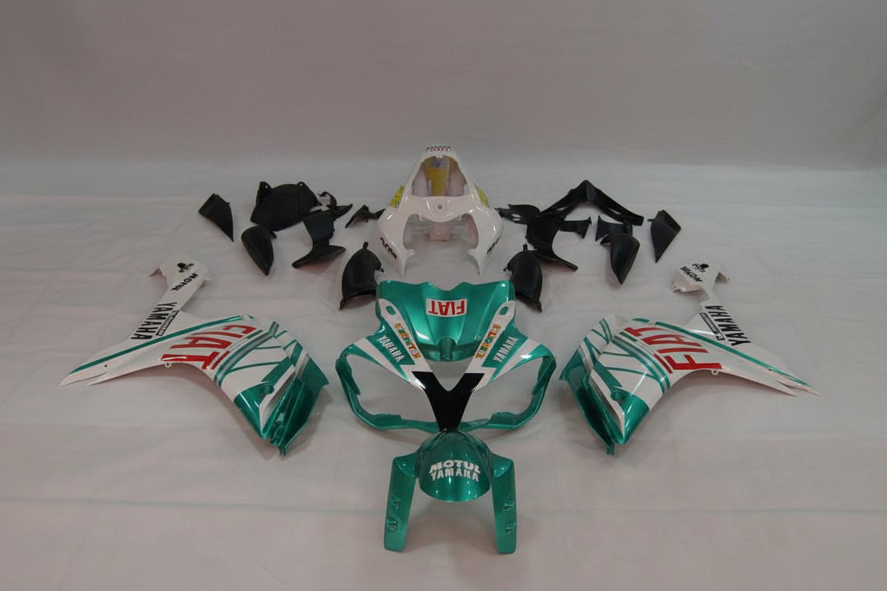 Motorcycle body parts with Fiat and Yamaha branding on a white background