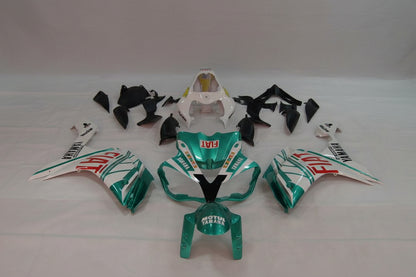 Motorcycle body parts with Fiat and Yamaha branding on a white background