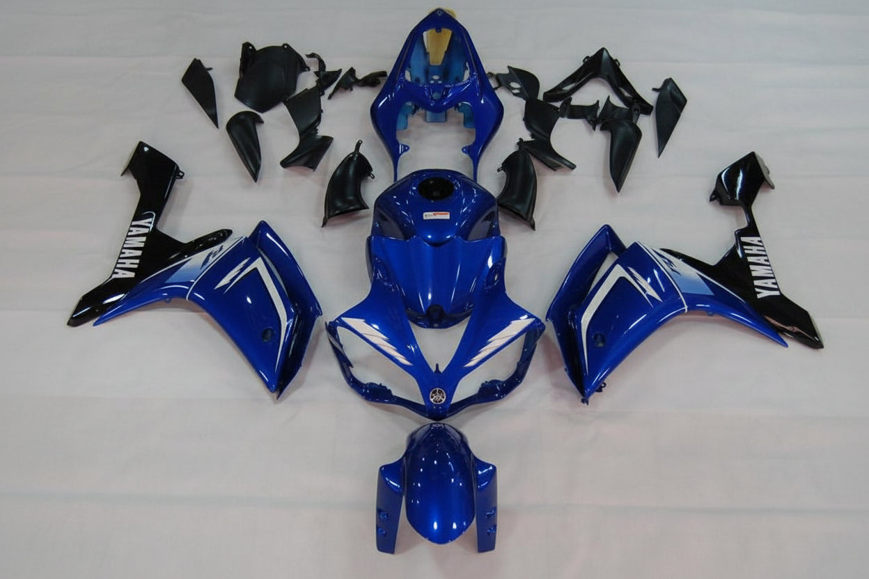 Blue and black motorcycle body parts on a white background