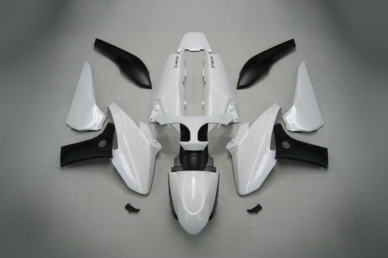 White motorcycle body parts with black accents on a gray background