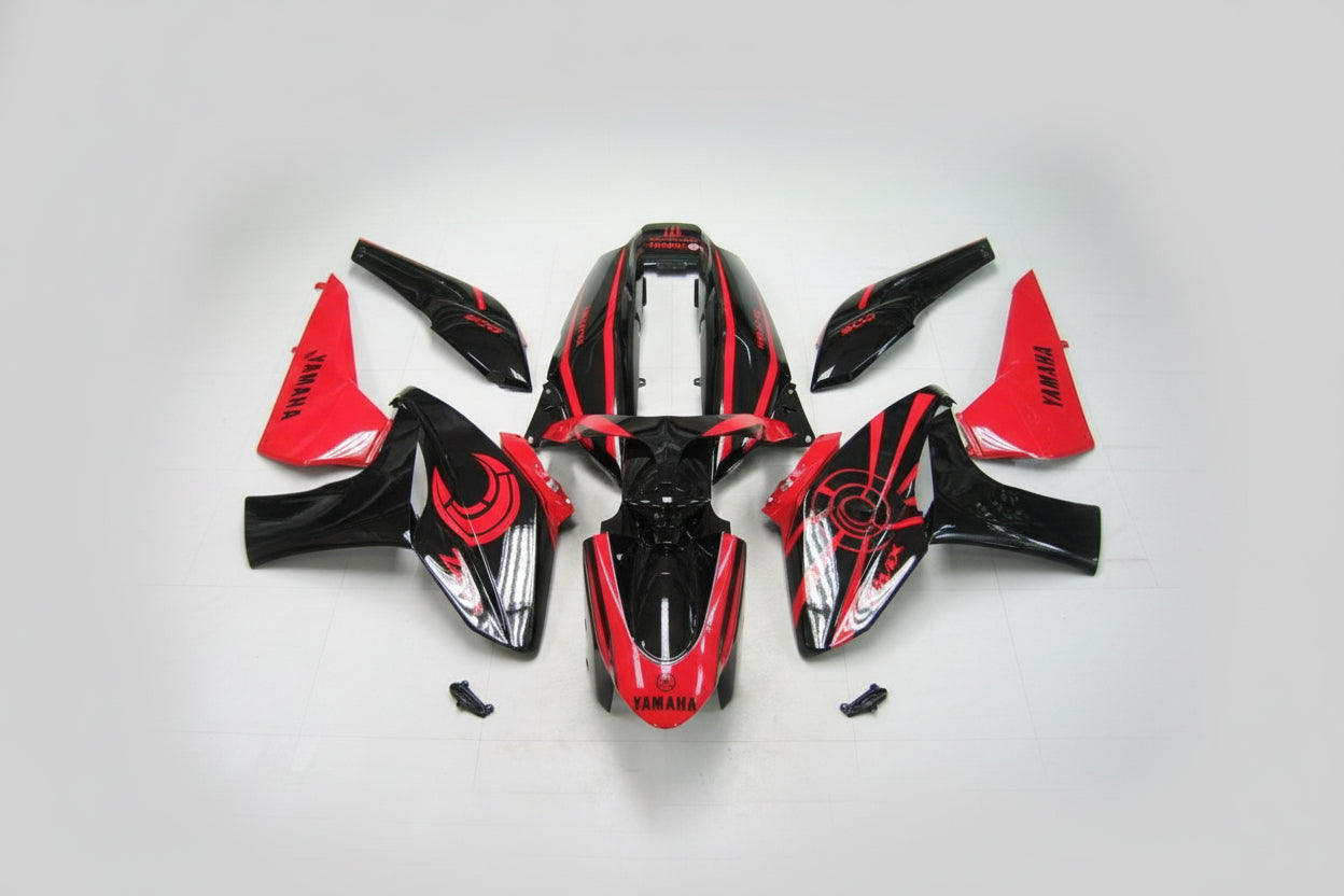 Red and black Yamaha motorcycle body parts on a white background