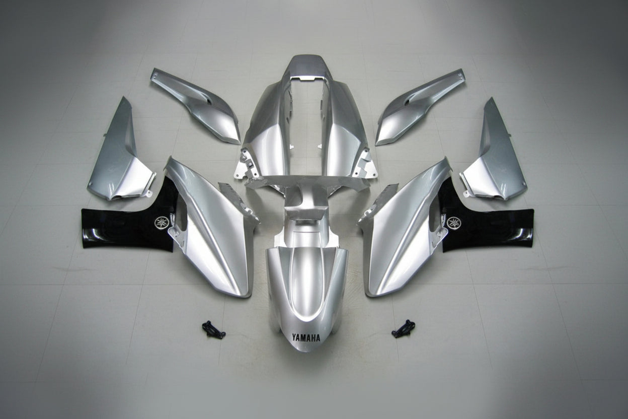 Silver motorcycle body parts on a white background