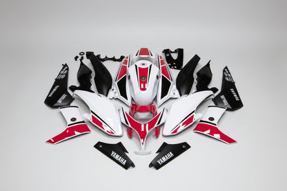 Motorcycle body panels with red and black design on a white background