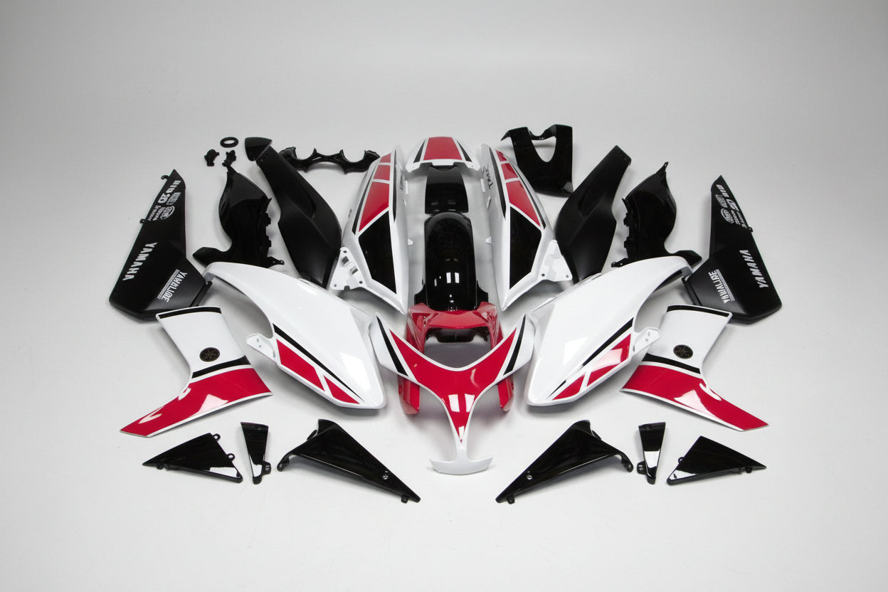 Motorcycle body panels with red and black design on a white background