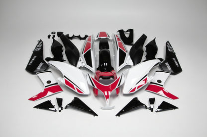 Motorcycle body panels with red and black design on a white background