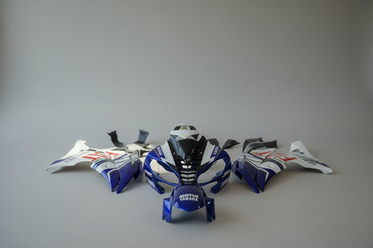 Motorcycle bodywork pieces with branding on a white background