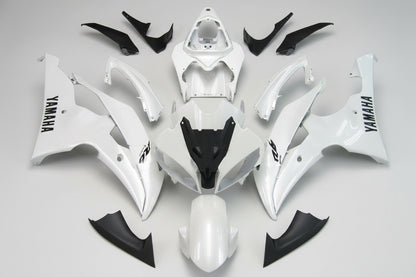 White and black motorcycle body parts with Yamaha branding on a white background