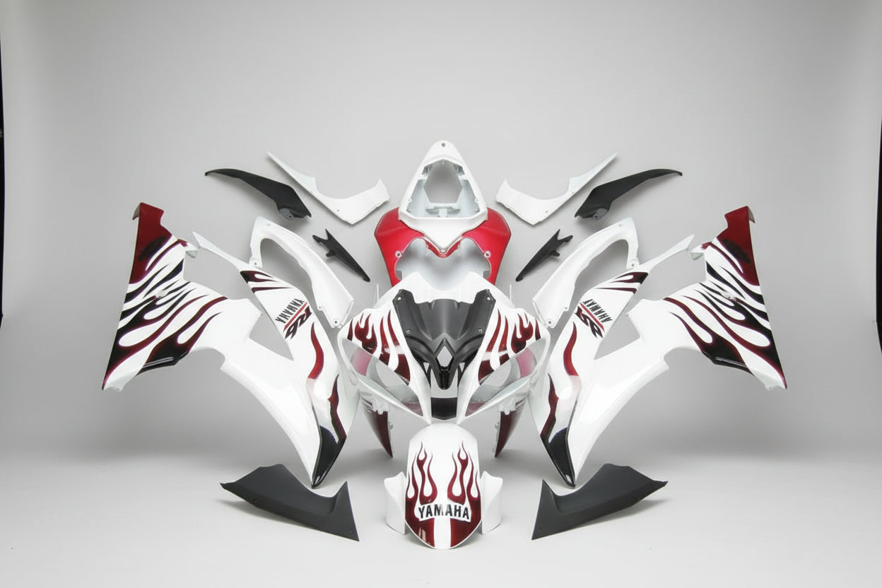 Motorcycle bodywork with red and black design on a white background
