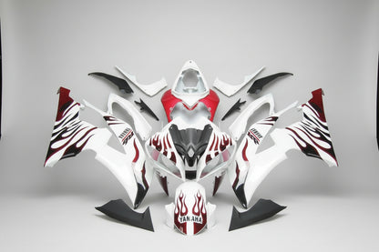 Motorcycle bodywork with red and black design on a white background