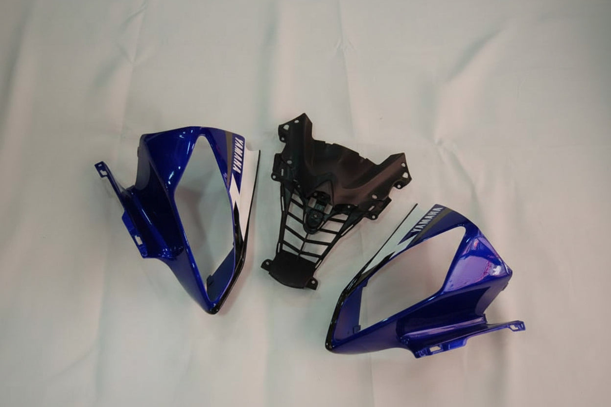 Blue and black motorcycle parts on a white background