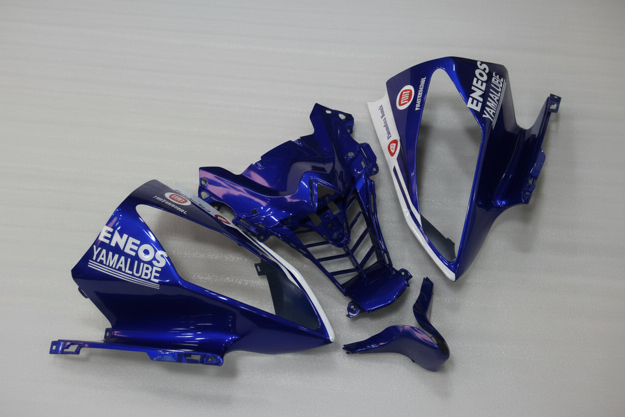 Blue motorcycle parts with Eneos Yamalube branding on a gray background