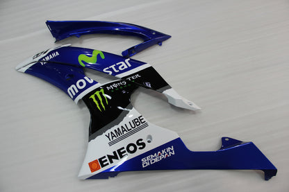 Motorcycle fairing with multiple brand logos on a white background