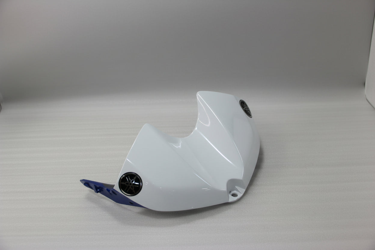 White motorcycle part with branding on a light gray background