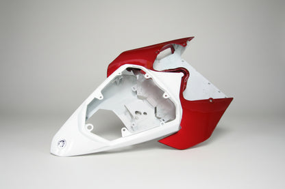 Red and white motorcycle fairing on a white background