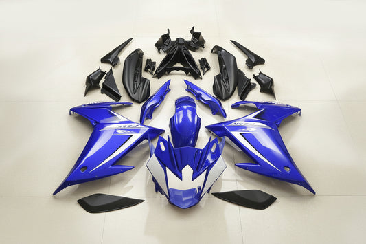 Blue and black motorcycle body parts on a white background