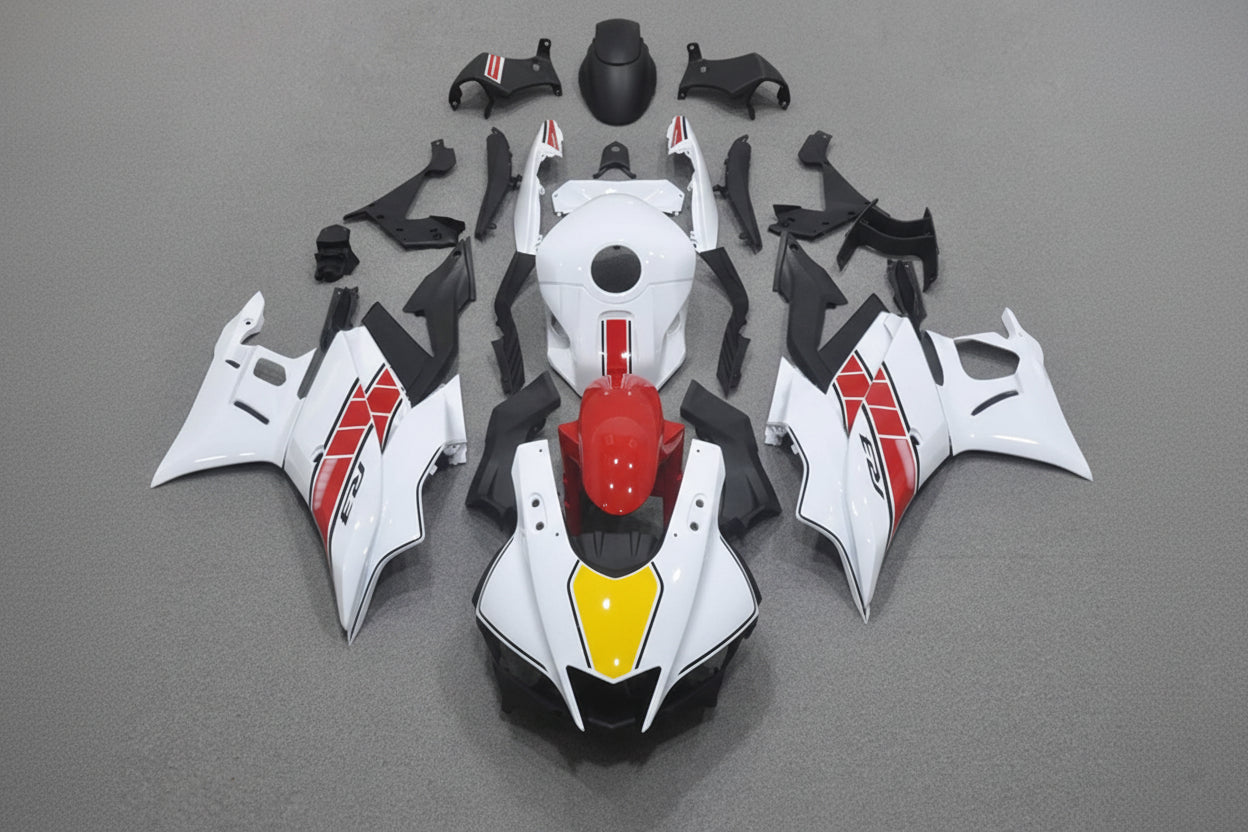 Motorcycle body parts on a gray background