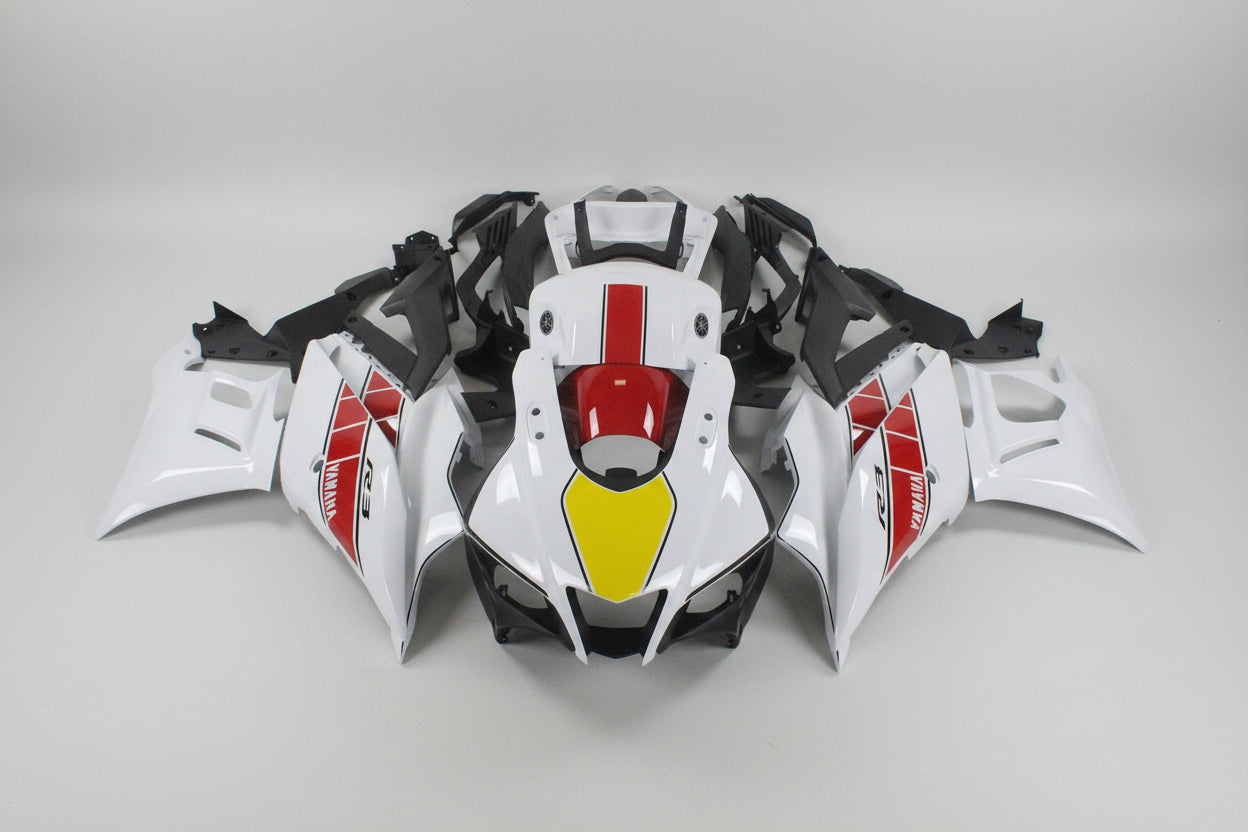 Motorcycle bodywork with red, yellow, and black design on a white background