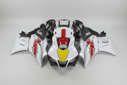 Motorcycle bodywork with red, yellow, and black design on a white background