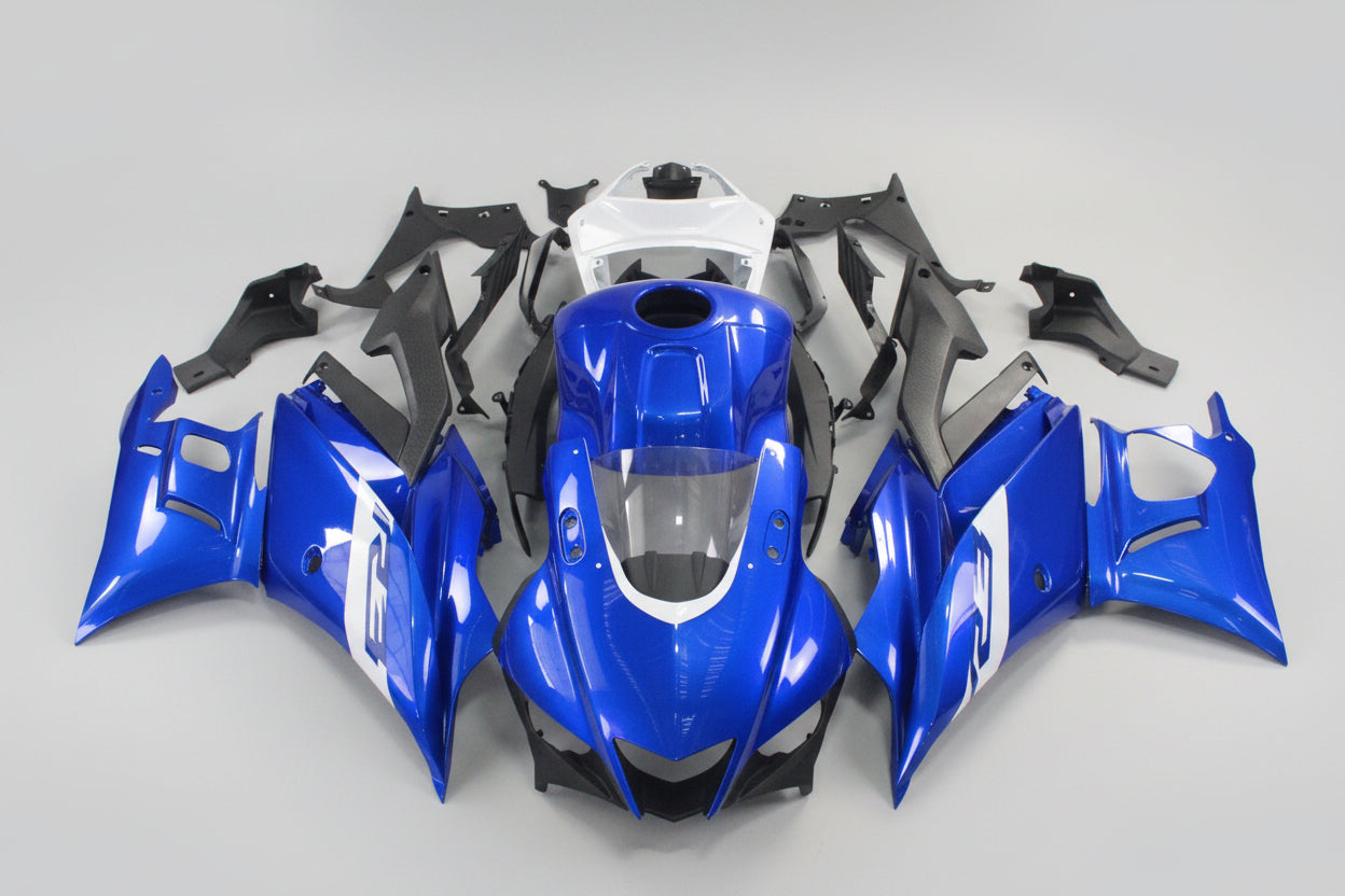 Blue motorcycle bodywork pieces on a white background