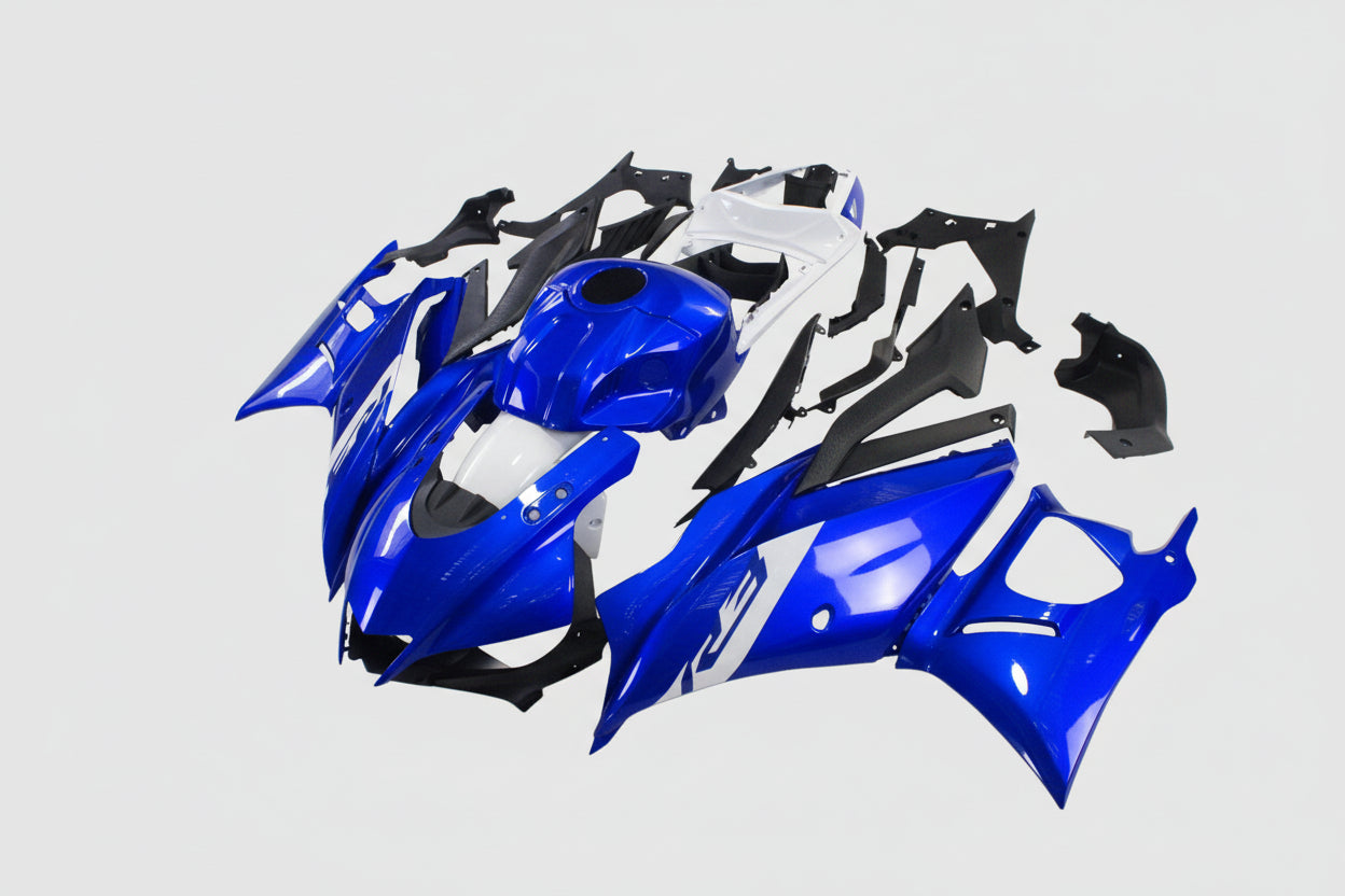 Motorcycle bodywork pieces in blue, white, and black on a white background