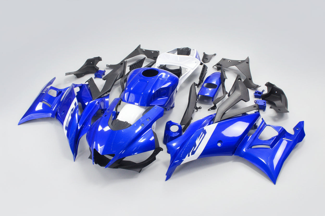 Blue motorcycle body parts on a white background
