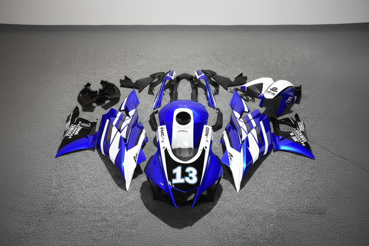 Motorcycle bodywork pieces with blue, white, and black design on a gray background