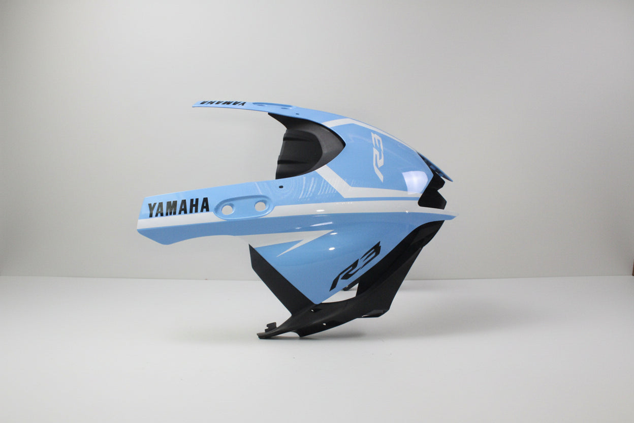 Blue motorcycle fairing with Yamaha branding on a white background