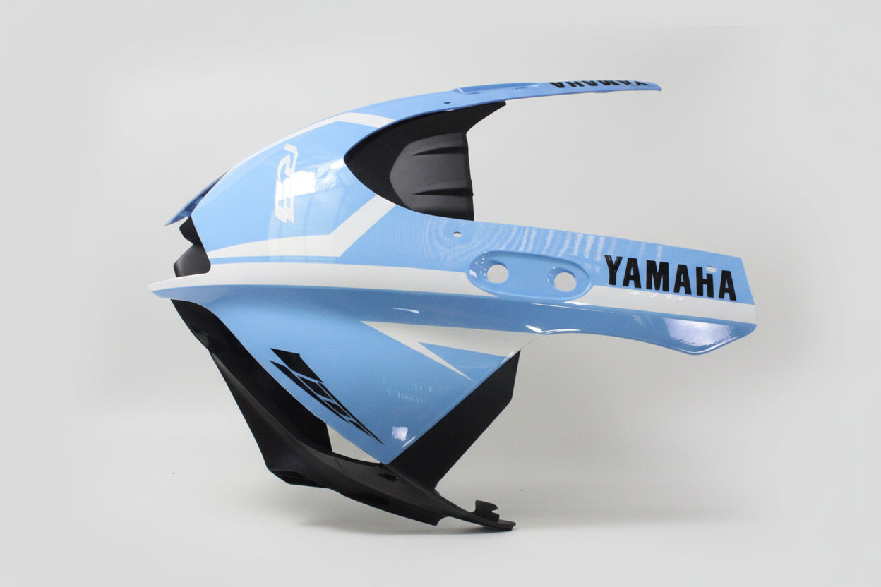 Blue and black motorcycle fairing with Yamaha branding on a white background