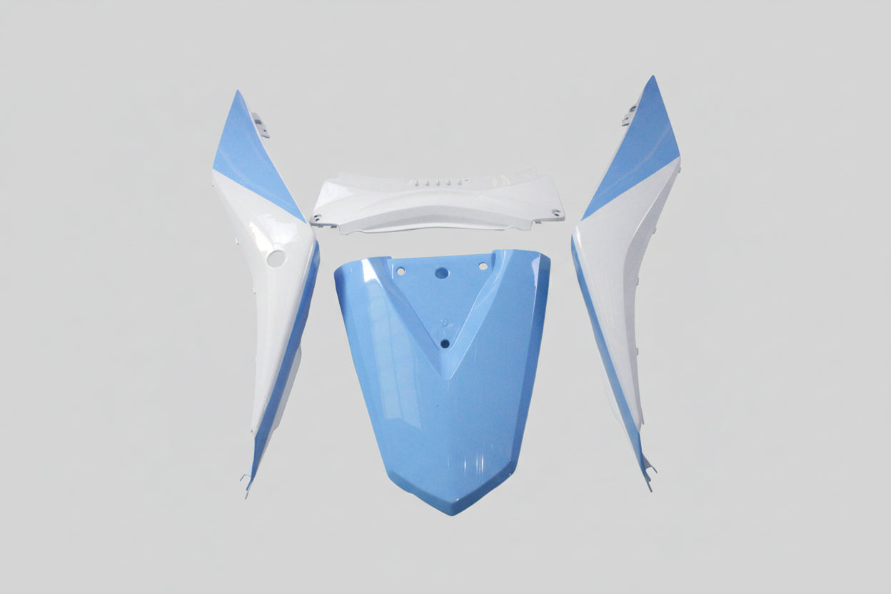 Blue and white motorcycle fairing parts on a white background
