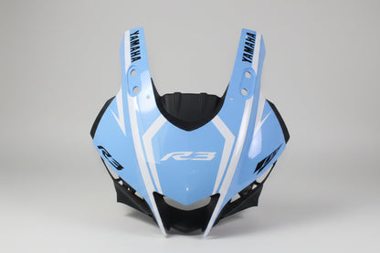 Blue motorcycle fairing with Yamaha branding on a white background
