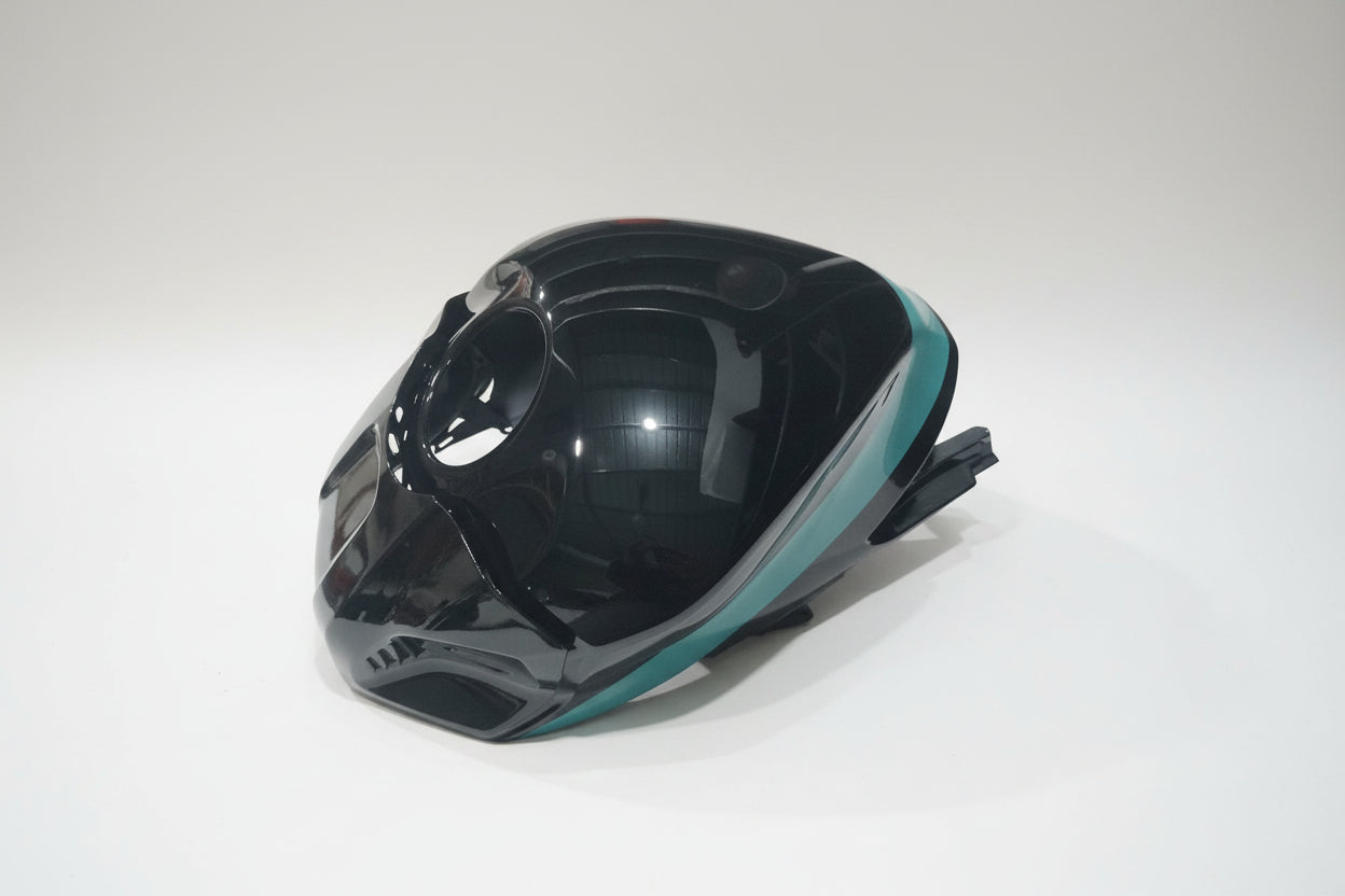 Black and teal motorcycle helmet on a white background