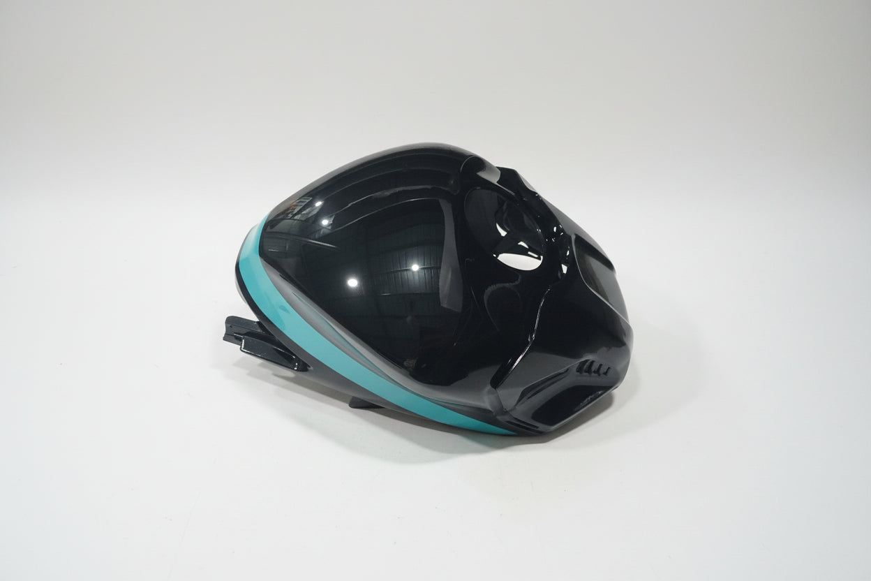 Black and teal motorcycle fairing on a white background
