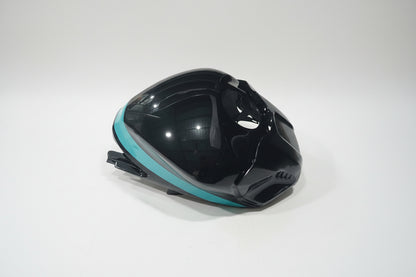 Black and teal motorcycle fairing on a white background